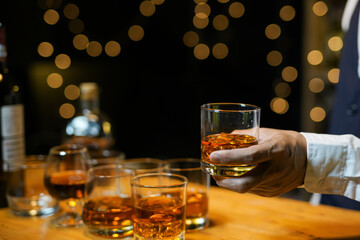 Bartender Serve Whiskey, on wood bar, 