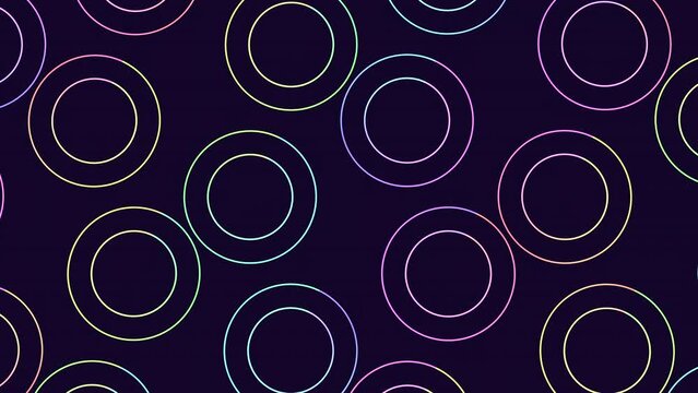A captivating image featuring a circular pattern of overlapping circles in vibrant shades of purple, blue, and green on a dark background