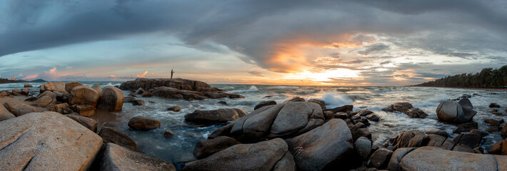 beautiful sea at sunset and fishing on stone
