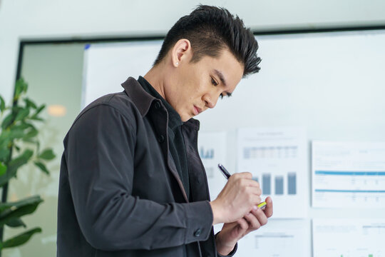 Business People working on sticky notes creative writing down ideas on post it notes professional investor start up project business