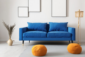 Light room. interior of the room, blue sofa and two yellow ottomans in front of it. interior design concept