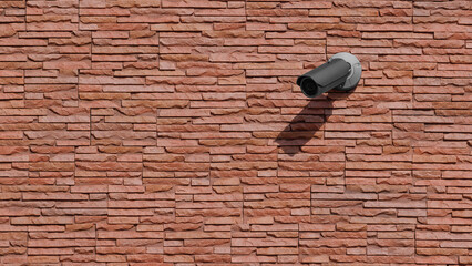 Black color modern CCTV Surveillance camera install on red brick wall by have water proof cover to...