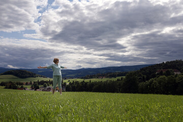 Countryside with a tourist field on the background of hills