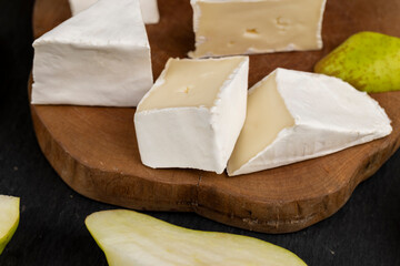 cheese with white mold cut into chunks