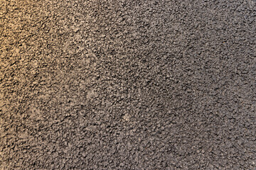 a close-up of a part of a new paved road