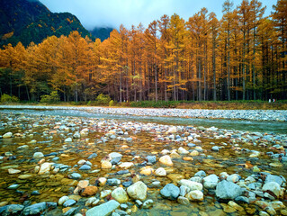 Kamikochi National Park in the Northern Japan Alps of Nagano Prefecture, Japan. Beautiful mountain in autumn leaf and Azusa river