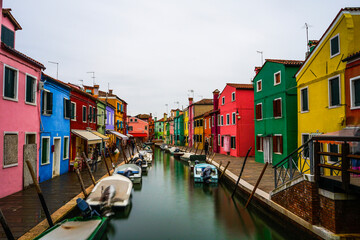 Colorful houses and canal in Burano island, Venice, Italy