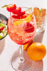 strawberry cocktail with orange and ice