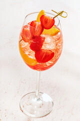 strawberry cocktail with orange and ice
