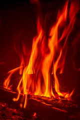 Fire in the fireplace, close-up of a burning firewood