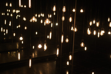Light bulbs in a dark room. Lighting decor. The concept of creativity.
