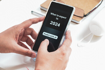 Woman using AI prediction mobile application to know the future. 2024 year expectations concept.