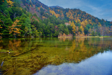 Idyllic landscape of Myojin pond at Hotaka Rear shrine in Kamikochi, Nagano, Japan (Japanese language meaning 