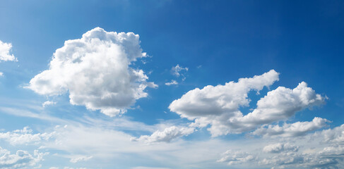 Large white clouds. Sky with fluffy white cloudscape texture. Wide blue sky nature background,...
