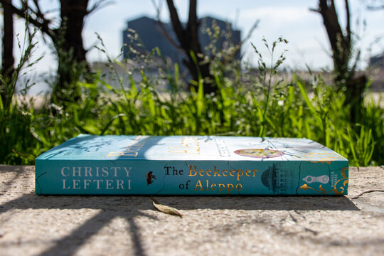 Close-up Christy Lefteri's The Beekeeper of Aleppo novel in the garden.