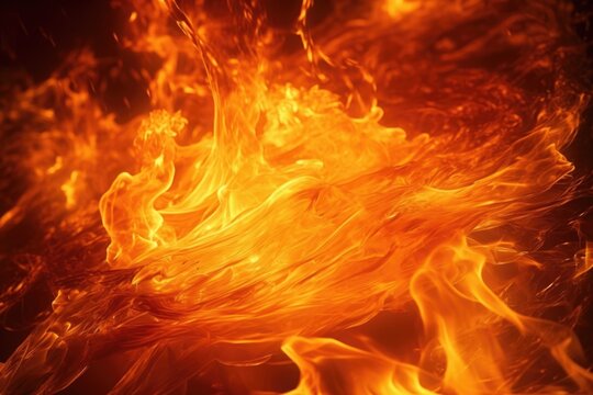 A close up view of a fire with a black background. This image can be used to create a dramatic and intense atmosphere