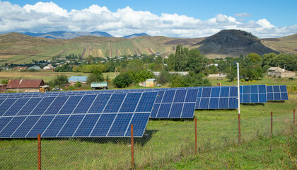 Solar panels in the green field.
