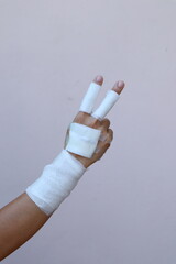 The woman wore a yellow shirt and had a bandage wrapped around her hand. After being injured while cooking