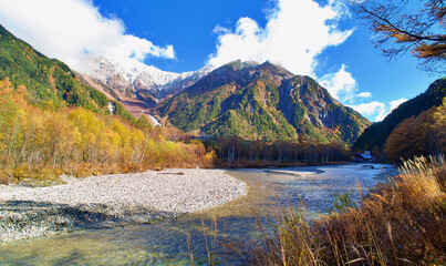 Kamikochi National Park in the Northern Japan Alps of Nagano Prefecture, Japan. Beautiful mountain in autumn leaf and Azusa river