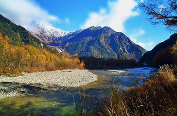 Kamikochi National Park in the Northern Japan Alps of Nagano Prefecture, Japan. Beautiful mountain in autumn leaf and Azusa river