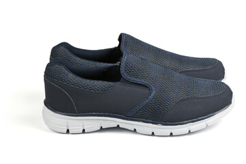 Pair of black fashionable stylish sports casual shoes isolated on white background