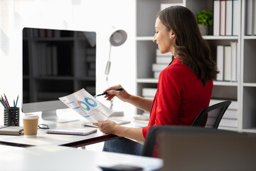 Portrait of attractive businesswoman working in business office.