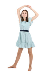 Young beautiful girl in a dress with polka dots on a white background.