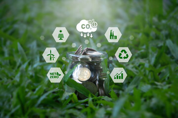 Carbon credit concept. A glass coin jar and CO2 icons. Investing in green businesses. Industry and...