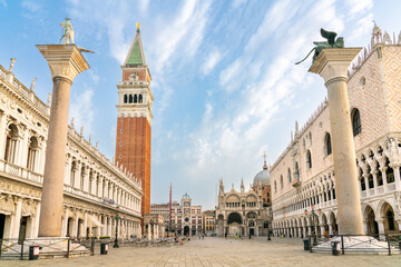 Empty St Mark's square in Venice with Campanile, Doge's Palace, and columns