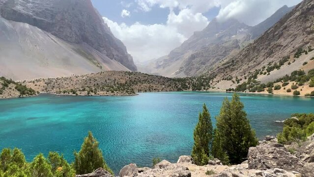 The Alaudin (Chapdara) lakes, lying at an altitude of 2800 m, are considered one of the most beautiful lakes of the Fan Mountains. Turquoise mountain lake. Pamiro-Alai. Tajikistan, Pamir 4K