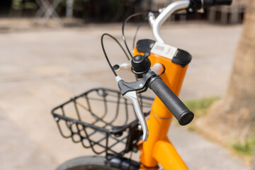 Close-up of a bicycle handlebar on the street, selective focus