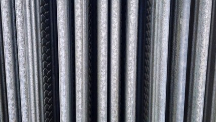 Stainless steel rods as a background, closeup of photo