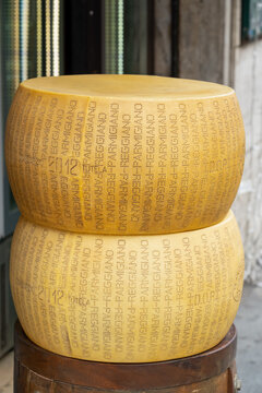 Modena, Emilia-Romagna Italy - May 10 2023: Two parmigiano reggiano cheese wheels from 2012 on display 