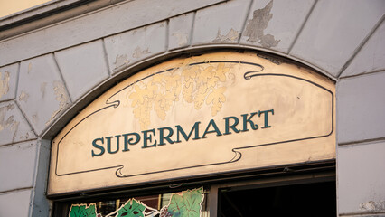 Fototapeta premium Signposts the direct way to Supermarket