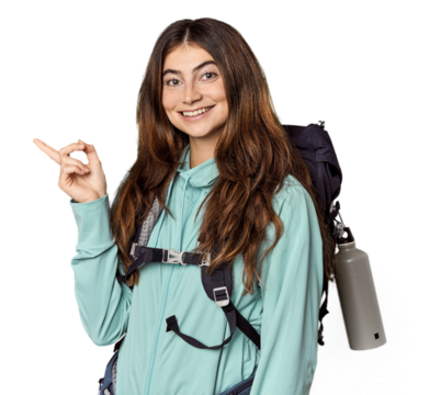 Young Caucasian woman with mountain backpack smiling and pointing aside, showing something at blank space.