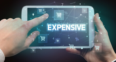 Close-up of a hand holding tablet with shopping inscription