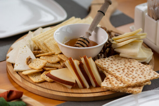 Cheese Plate with different types of cheese Snack assortment on plate.