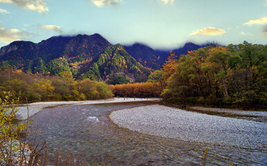 Kamikochi National Park in the Northern Japan Alps of Nagano Prefecture, Japan. Beautiful mountain in autumn leaf and Azusa river