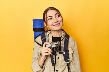 Photographer with gear ready to explore dreaming of achieving goals and purposes