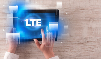 Close-up of a hand holding tablet