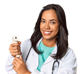 Young Filipina doctor holding body temperature meter