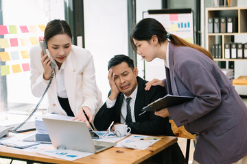 Group of Asian business meeting in planning design in creative business discussing work in the modern office