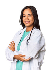 Young Filipina doctor confidently posing in studio