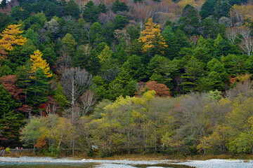 Kamikochi National Park in the Northern Japan Alps of Nagano Prefecture, Japan. Beautiful mountain in autumn leaf and Azusa river