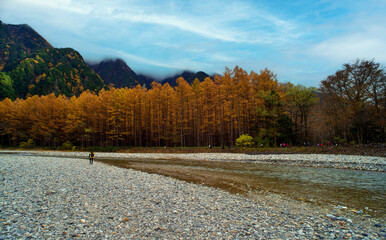 Kamikochi National Park in the Northern Japan Alps of Nagano Prefecture, Japan. Beautiful mountain in autumn leaf and Azusa river