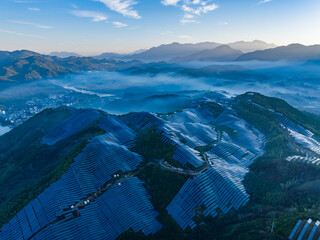 Aerial photography of solar photovoltaic panels on mountain top