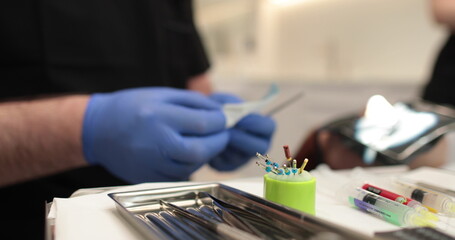 Protaper needles that a nurse prepares for use by a doctor in dentistry. - obrazy, fototapety, plakaty