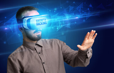 Businessman looking through Virtual Reality glasses, virtual security concept