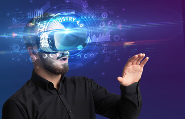 Businessman looking through VR glasses