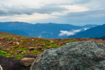 Beautiful mountain landscape with clouds and haze. Background.